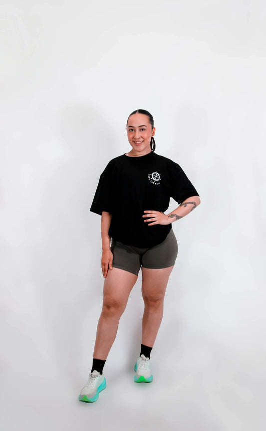 Full-body shot of a model wearing the Classic Graphic Buff Tee from the front, highlighting its versatile fit and design.
