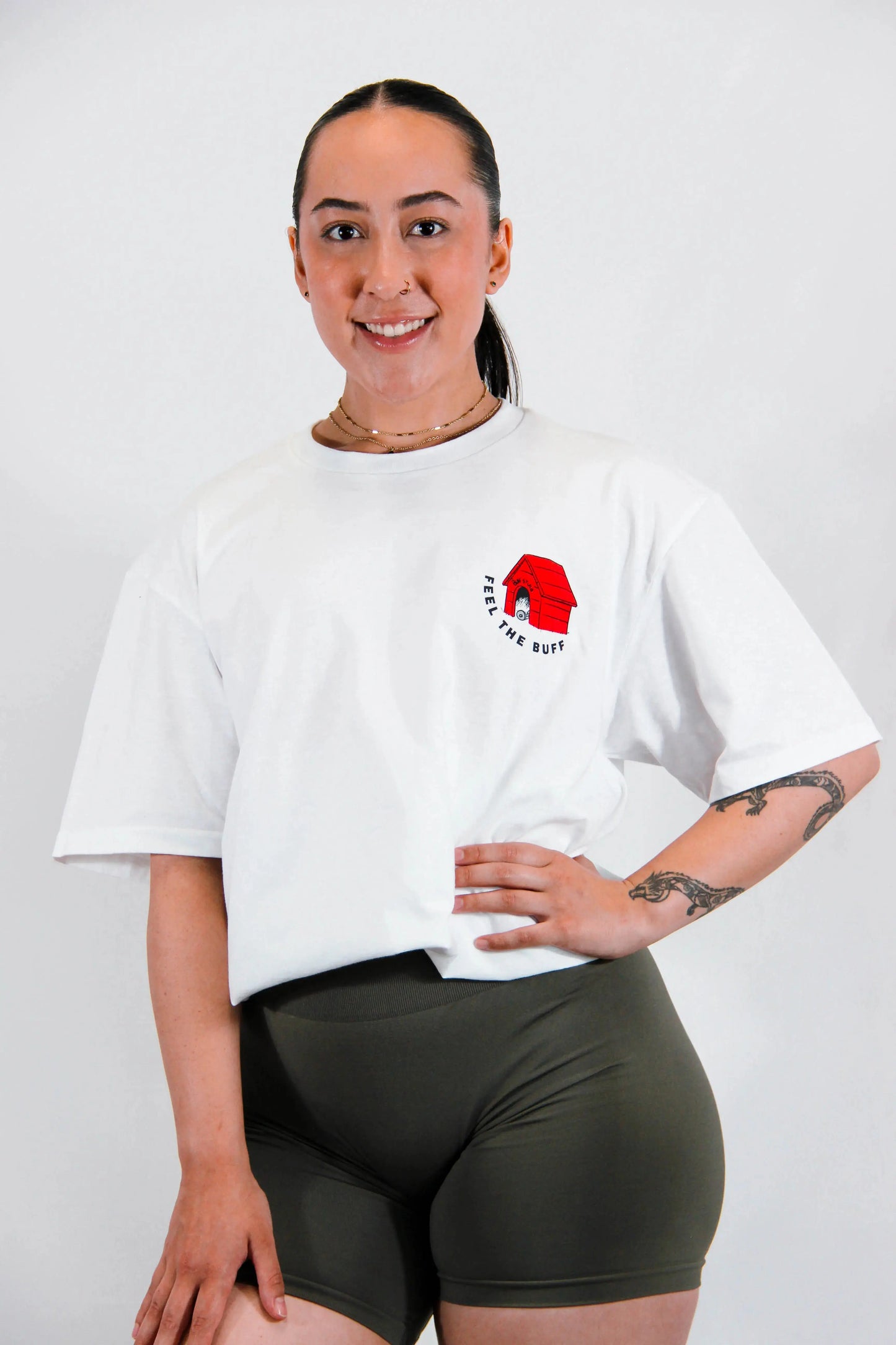 Front view of a model wearing the Classic Graphic Buff Tee, featuring the dog house graphic that complements the Scoopy design on the back.