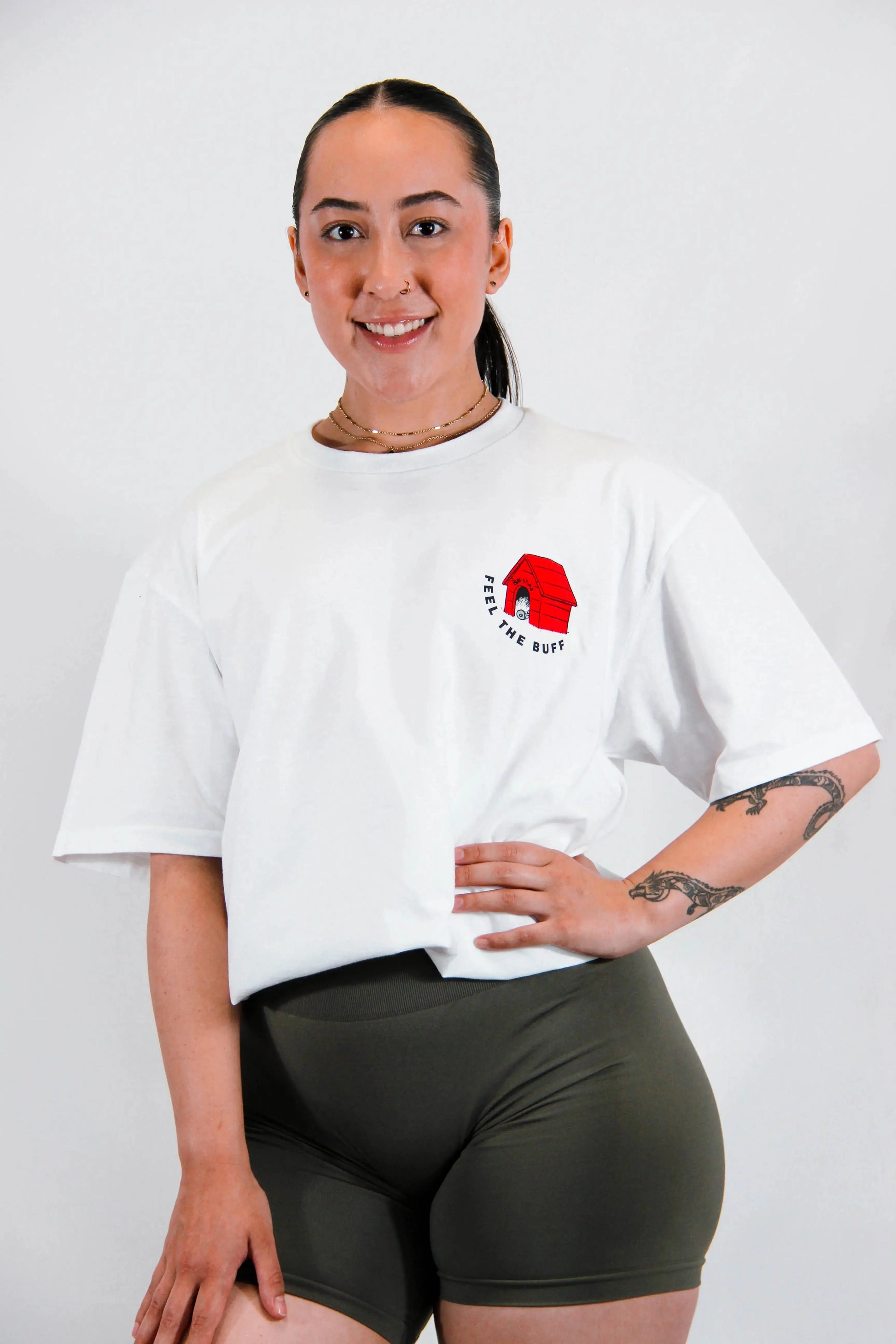 Front view of a model wearing the Classic Graphic Buff Tee, featuring the dog house graphic that complements the Scoopy design on the back.