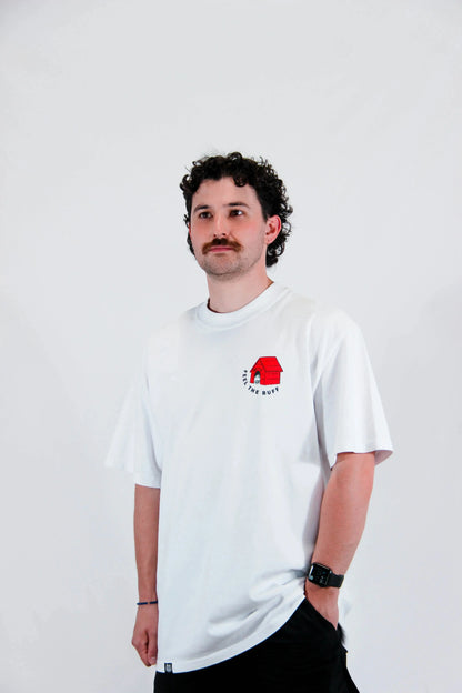 Front view of a model wearing the Premium Buff Cover, featuring the dog house graphic that complements the Scoopy design on the back.