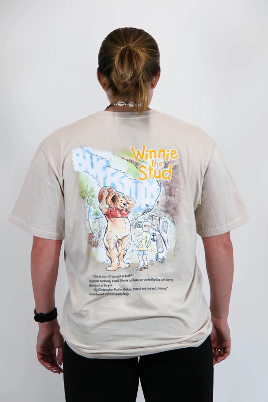 Back view of a model wearing the Classic Graphic Buff Tee, showcasing the unique Winnie the Stud graphic design.