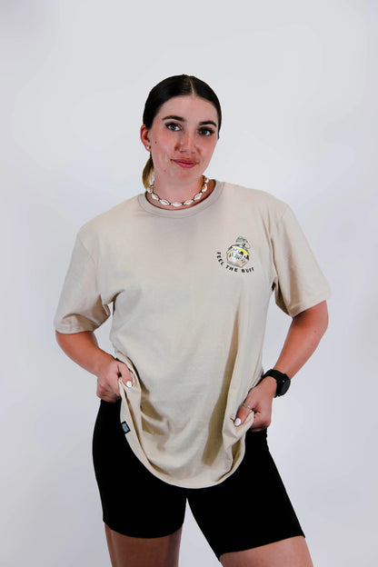 Front view of a model wearing the Classic Graphic Buff Tee, featuring a pot of Hunny graphic that complements the Winnie the Stud design on the back.