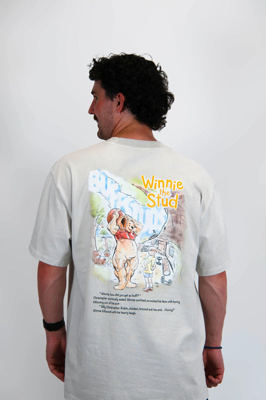 Back view of a model wearing the Premium Buff Cover, showcasing the unique Winnie the Stud graphic design.